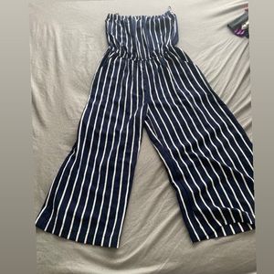 Navy blue and white striped romper, wide legs.